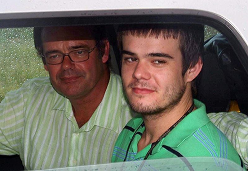 Joran van der Sloot, right, sits in a car with his father, Paulus Van Der Sloot, after Joran was released from custody near Oranjestad, Aruba, in this Friday, Dec. 7, 2007, file photo.