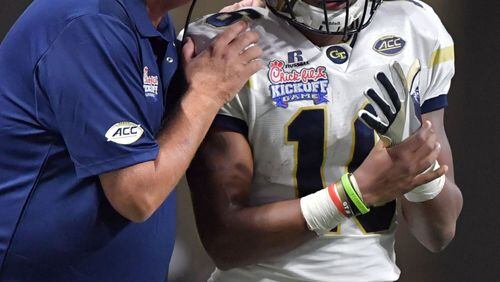 Jackets head coach Paul Johnson instructs quarterback TaQuon Marshall (16) in the first half of NCAA college football game at the Mercedes-Benz Stadium on Monday, September 4, 2017. (HYOSUB SHIN / HSHIN@AJC.COM)