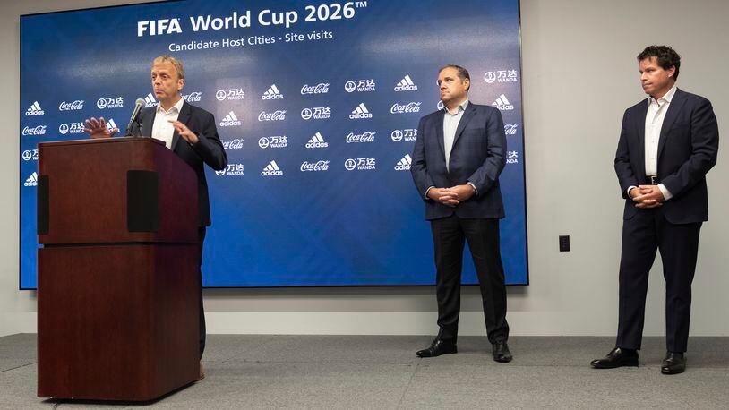 Colin Smith, FIFA chief tournaments & events officer, answers a question during a news conference in September 2021 at Mercedes-Benz Stadium in Atlanta as Victor Montagliani, FIFA vice president and CONCACAF president (center), and Dan Corso, president of Atlanta Sports Council, listen. Officials were touring the stadium as part of the FIFA World Cup 2026 Candidate Host City Tour. (AP Photo/Ben Gray)