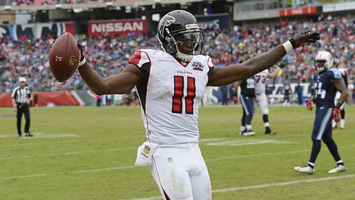 Atlanta Falcons wide receiver Julio Jones (11) celebrates after scoring a touchdown against the Tennessee Titans in the second half of an NFL football game Sunday, Oct. 25, 2015, in Nashville, Tenn. The Falcons won 10-7. (AP Photo/Mark Zaleski)