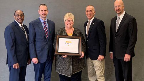 On the occasion of receiving accreditation from the Commission on Accreditation for Law Enforcement Agencies, (L-R) are CALEA Commission Chair Anthony Purcell, Kennesaw City Manager Dr. Jeff Drobney, Kennesaw/Acworth 911 Director Linda Davis, Kennesaw Mayor Derek Easterling and CALEA Executive Director Craig Hartley. (Courtesy of Kennesaw)