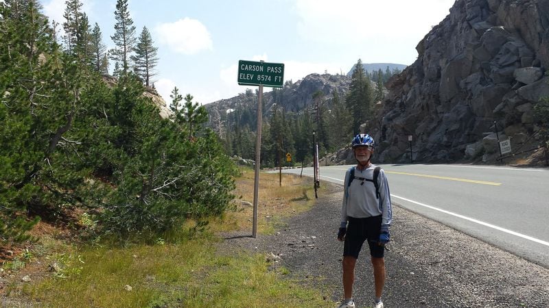 Irv Hoffman drove through some of the most intense elevations in the Rocky Mountains, but biked 100 percent of the time from California to Utah and from Colorado to Georgia. Here, he poses next to a sign for Carson Pass in California, which is 8,574 feet above sea level. CONTRIBUTED BY IRV HOFFMAN