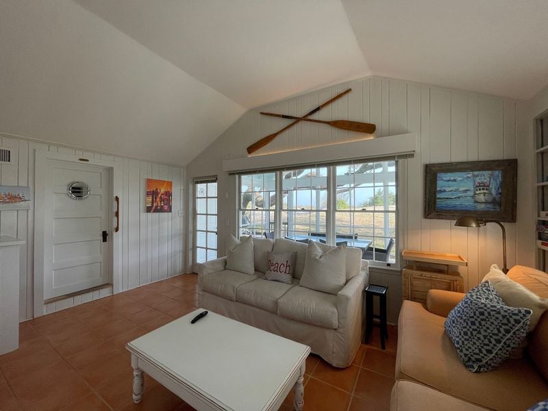 The home boasts oceanfront views on Gould’s Inlet, just 30 steps from the beach.