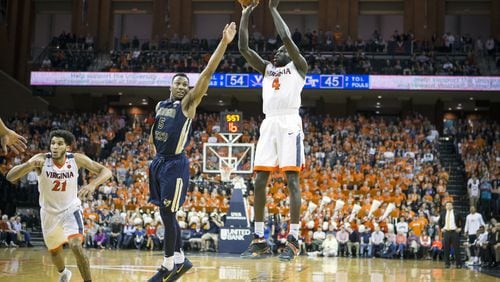 CHARLOTTESVILLE, VA - JANUARY 21: Marial Shayok #4 of the Virginia Cavaliers shoots the ball over Josh Okogie #5 of the Georgia Tech Yellow Jackets during a game at John Paul Jones Arena on January 21, 2017 in Charlottesville, Virginia. (Photo by Chet Strange/Getty Images)