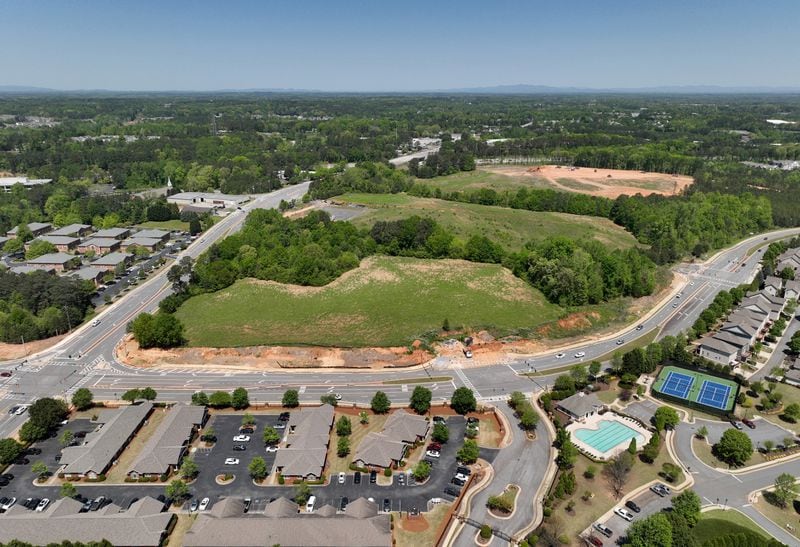 Aerial photograph shows the site of a proposed mixed-use development and arena with the goal of bringing a NHL franchise back to metro Atlanta, along Ga. 400, Tuesday, April 18, 2023, in Alpharetta. The project, called The Gathering at South Forsyth, aims to transform roughly 100 acres along Ga. 400 into an entertainment hub centered around an 18,000-seat arena. (Hyosub Shin / Hyosub.Shin@ajc.com) 