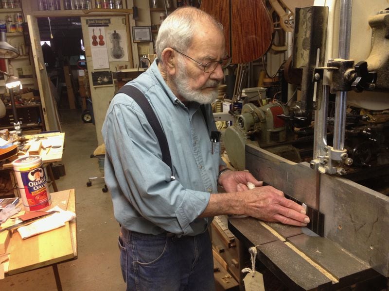 The late Wade Lowe, a well-known Decatur-area luthier, helped his friend Jack Brantley with the restoration of the vintage mandolin. Here he works on the fretboard of another instrument.  Photo: Jack Brantley