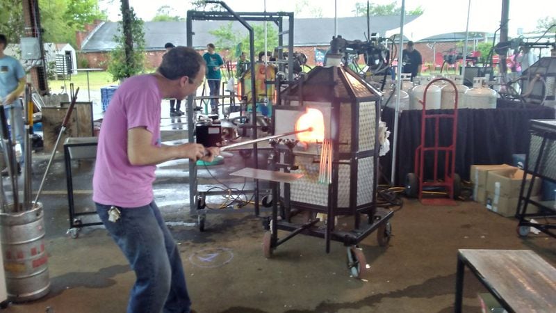 Philip Vinson of Mobile Glassblowing Studios practices his craft at last spring’s Hot Glass Craft Beer Festival. Contributed by Blake Guthrie