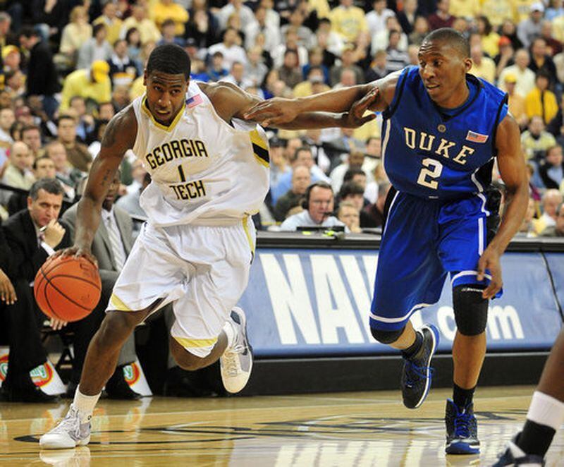 Tech guard Iman Shumpert (left) uses his left arm to try to get past Duke's Nolan Smith.