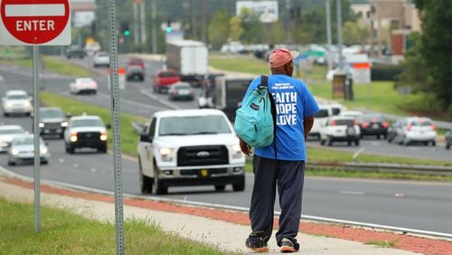 A homeless man makes his way down Cobb Parkway near Bells Ferry Road in Marietta. A panel of lawmakers and other interesed parties are sending a list of recommendations to the Georgia Senate to help the state tackle homelessness. Curtis Compton/ccompton@ajc.com