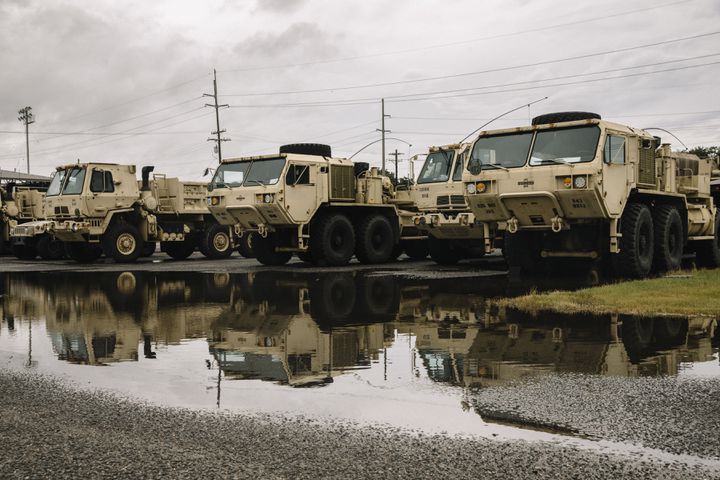 National Guard vehicles are staged and ready for rescue efforts in Lake Charles, La., Wednesday, Aug. 26, 2020, ahead of Hurricane Laura. The city of Lake Charles and members of the U.S. military ran a joint effort to bus citizens out of the mandatory evacuation zone. (William Widmer/The New York Times)