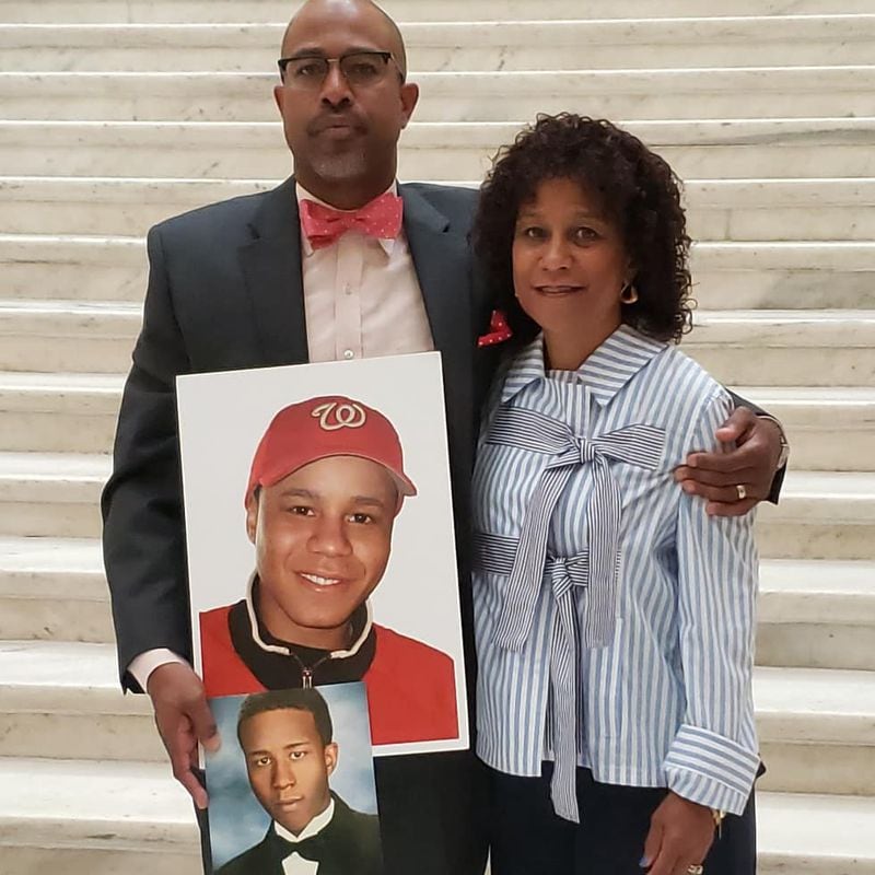 Marcus Coleman, cousin of Charlie Jones III, stands with Jones' mother, Sharon McCarter. Jones, 23, was killed by a hit-and-run driver while walking along Piedmont Road in East Cobb in January 2009.