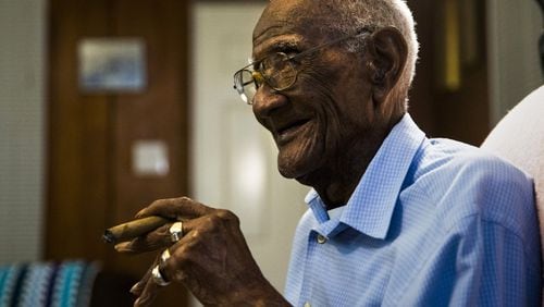 U.S. Army veteran Richard Overton sits in his chair smoking a cigar at 4:54 a.m. on Saturday, May 5, 2018 at his home in Austin, Texas. Mr. Overton turned 112 on May 11. He rises some time between 3 and 5 a.m. and smokes about 15 cigars a day. (Ashley Landis/Dallas Morning News/TNS)
