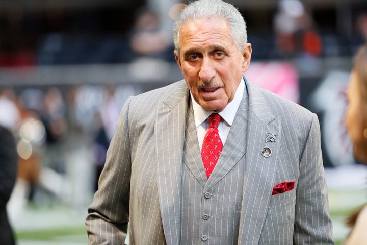 Falcons owner Arthur Blank walks on the field before the game against the Browns on Sunday in Atlanta. (Miguel Martinez / miguel.martinezjimenez@ajc.com)