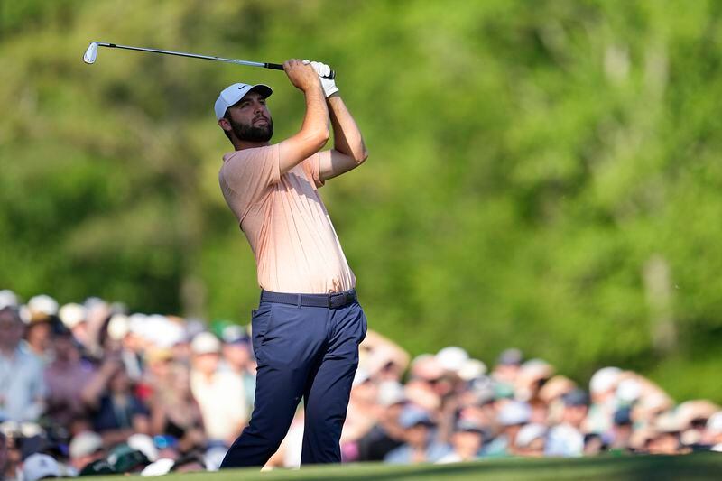Scottie Scheffler watches his tee shot on the 12th hole during final round at the Masters golf tournament at Augusta National Golf Club Sunday, April 14, 2024, in Augusta, Ga. (AP Photo/George Walker IV)