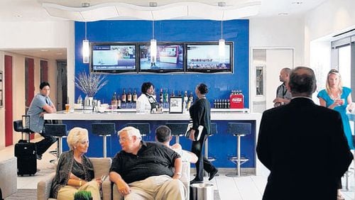 Travelers get in some downtime in the renovated Delta Sky Club in Concourse B.