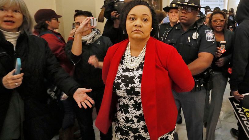 11/13/18 - Atlanta - Senator Nikema Williams, District 39 Democrat, is arrested for failing to disperse during a demonstartion in the rotunda.  Lawmakers were back in town Tuesday in a special session to begin considering two bills - one to provide $270 million in aid to SW Georgia and the other to give airlines and farmers a tax break for re-planting trees    BOB ANDRES / BANDRES@AJC.COM