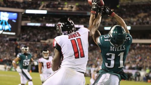 Eagles cornerback Jalen Mills defends against Falcons wide receiver Julio Jones, breaking up a pass to the end zone during the first half of Saturday’s game in Philadelphia.
