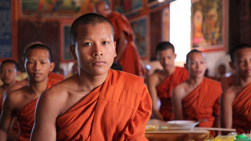 Young monks chant in anticipation of their daily meal inside one of the many temples at Oudong, in central Cambodia. (Andrew Evans/Chicago Tribune/TNS)