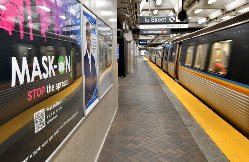 March 25, 2021 Atlanta - ÒMask OnÓ sign is visible as a train departs at the Five Points MARTA station on Thursday, March 25, 2021. (Hyosub Shin / Hyosub.Shin@ajc.com)