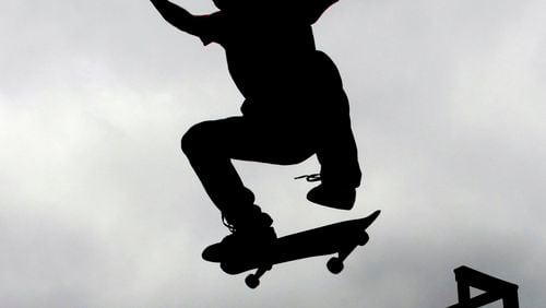 Michael Moore, from Marietta, practices his skate board technique in Kennesaw.