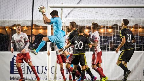 Atlanta United goalie Alec Kann grabs the ball out of the air Saturday, Feb. 18, 2017 in Charleston. (Photo by Alex Holt)