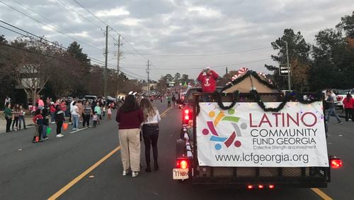 The Latino Community Fund takes part in a Christmas parade in the town of Tifton in South Georgia on Saturday, December 4, 2021.