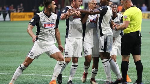 June 2, 2018 Atlanta: Philadelphia Union players Haris Medunjanin (from left) and Alejandro Bedoya are held back by teammates as they both draw red cards and are ejected from the game against the Atlanta United during the first half in a MLS soccer match on Saturday, June 2, 2018, in Atlanta.  Curtis Compton/ccompton@ajc.com