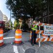 Molena, Georgia assistant police chief, Jesus Lopez helped putting up closure signage on 6th Street on Peachtree Street. A construction project that got underway on Wednesday in Midtown Atlanta closed a portion of Peachtree Street for several days, officials said.
