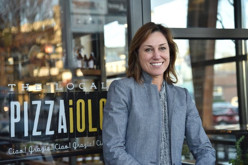 Allison Hill, CEO of The Local Pizzaiolo, is helping to launch a Neapolitan pizza chain in Atlanta. One early decision: the first restaurant in the chain doesn’t accept cash from customers. You can pay by credit, debit or with a plastic cash card. HYOSUB SHIN / HSHIN@AJC.COM