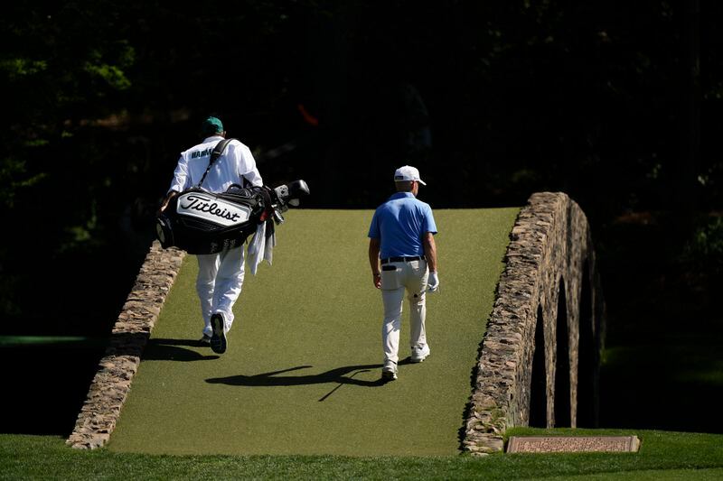 Brian Harman walks to the 12th green during a practice round in preparation for the Masters golf tournament at Augusta National Golf Club Sunday, April 7, 2024, in Augusta, Ga. (AP Photo/Charlie Riedel)