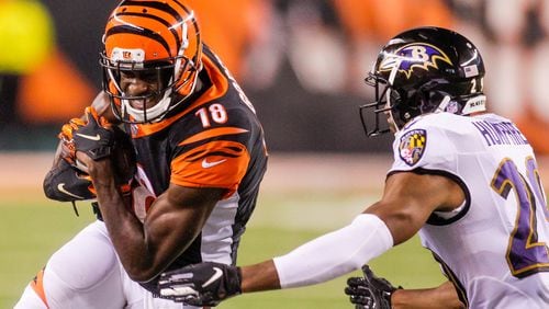Cincinnati Bengals wide receiver A.J. Green carries the ball in for a touchdown during their game against the Baltimore Ravens Thursday, Sept. 13 at Paul Brown Stadium in Cincinnati.