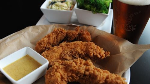 T.Mac Hand-Breaded Chicken Tenders served with a choice of Honey Mustard or BBQ sauce. Sides of fresh broccoli and Poblano cole slaw.(BECKY STEIN)