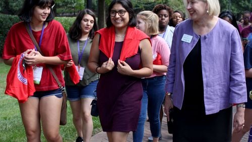 Rachel de las Casas and Natalia Rosas, (left to right) incoming first-year students at Agnes Scott College, talk to the president of the college, Leocadia (Lee) I. Zak at Agnes Scott College on Thursday, Aug. 23. JENNA EASON / JENNA.EASON@COXINC.COM