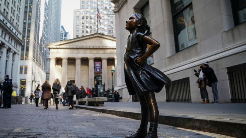 The Fearless Girl statue moved to its new home Monday, across from the New York Stock Exchange.