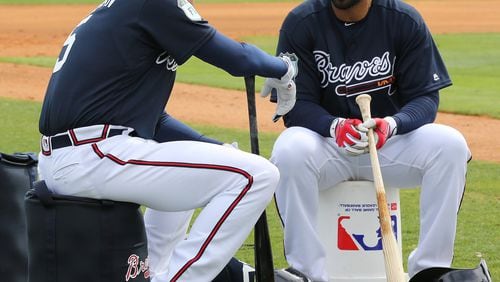 Freddie Freeman (left) chats with Matt Kemp during a break in an early spring training workout. Freeman is 5-for-6 with four RBIs in his past two games and has a .524 average (22-for-42) that would lead the majors if he wasn’t just shy of the minimum plate appearances to qualify. (Curtis Compton/ccompton@ajc.com)