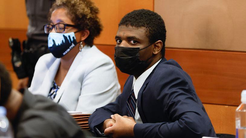 Jayden Myrick, a defendant in YSL/Young Thug trial and his attorney Gina Bernard sit in court for jury selection on Wednesday, January 4, 2023.  (Natrice Miller/natrice.miller@ajc.com)