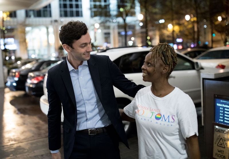 Jon Ossoff, left, greets Charly Aaron as he arrives for an election night party for Atlanta mayoral candidate Keisha Lance Bottoms, who is running against mayoral candidate Mary Norwood, at the Hyatt Regency Hotel, Tuesday, Dec. 5, 2017, in Atlanta.  BRANDEN CAMP/SPECIAL