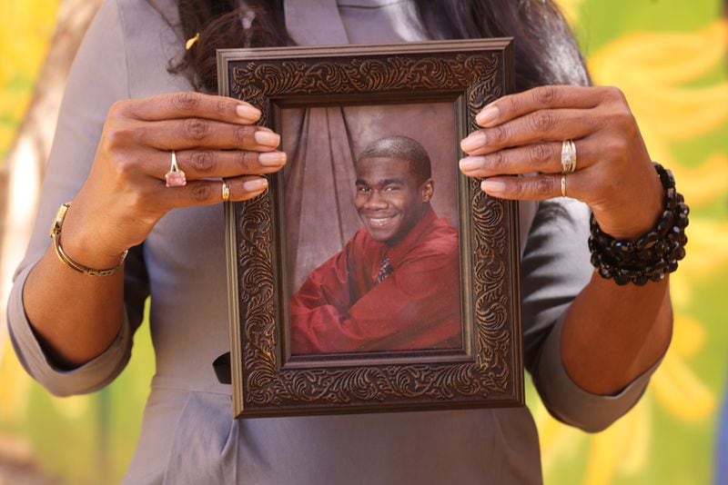 Monteria Robinson holds a portrait of her son Jamarion Robinson. He was shot 59 times during a federal task force raid. It took five years for the two officers involved to be indicted on charges including murder and making false statements. Wednesday, November 10, 2021. Miguel Martinez for The Atlanta Journal-Constitution 