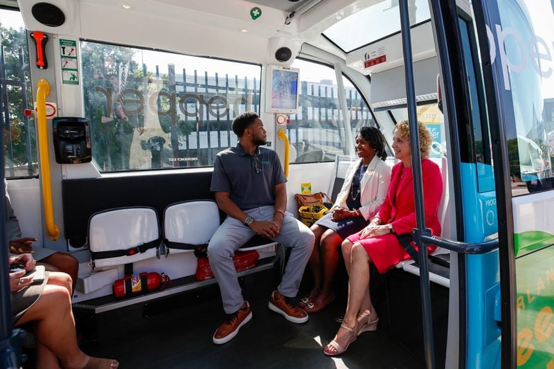 Leaders take the first ride of the shuttle at the unveiling of the Cumberland Hopper in Atlanta on Tuesday, July 25, 2023. (Katelyn Myrick/katelyn.myrick@ajc.com)