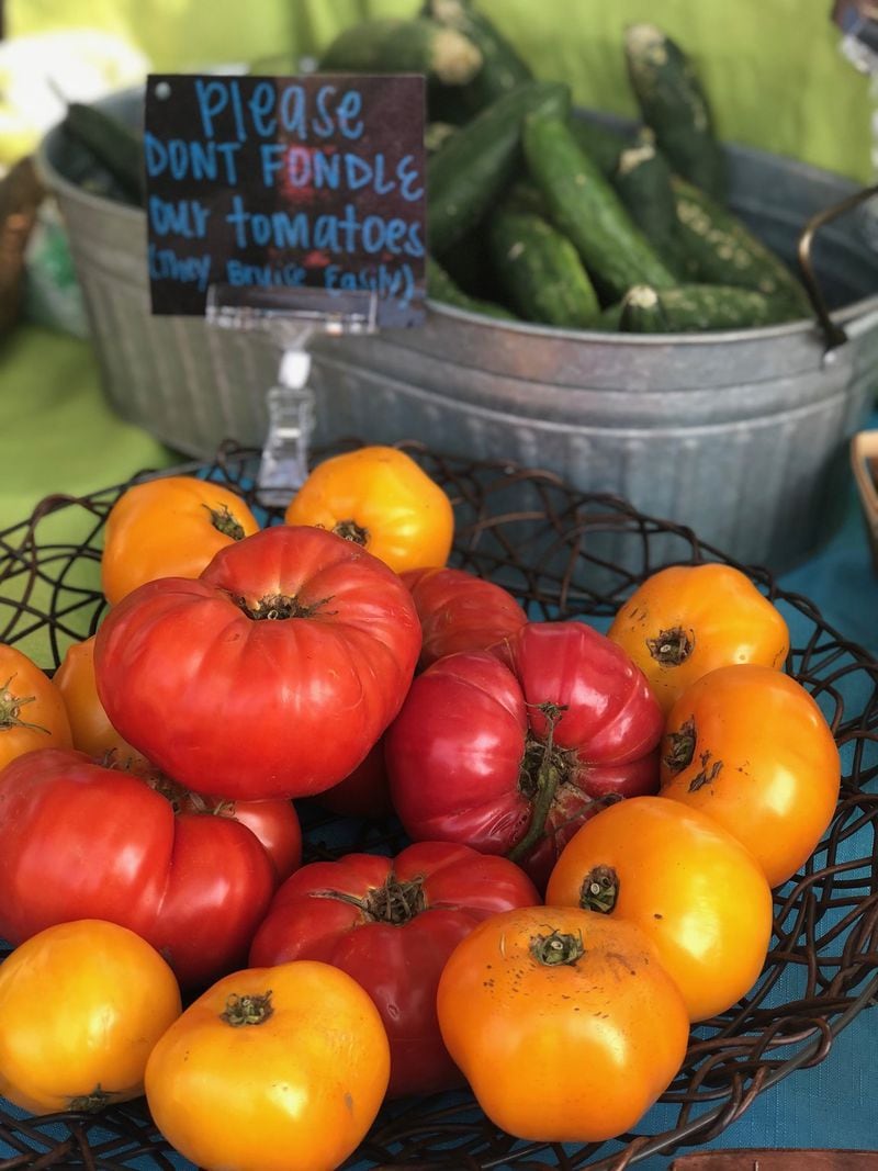 One of the draws for farmers market shoppers is the variety of heirloom vegetables, like these tomatoes sold at the Vickery Village Farmers Market, available only at a local farmers market. CONTRIBUTED BY SUSAN GRINWALD