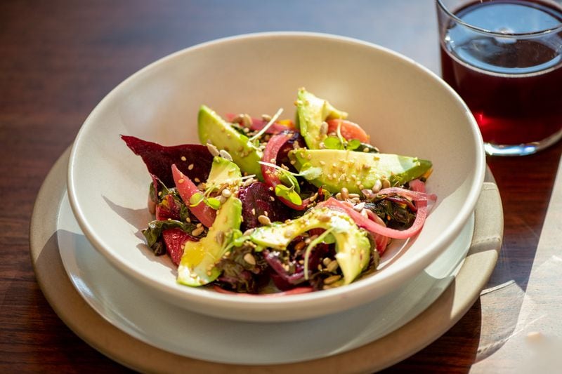 Le Bon Nosh beets, beet greens, avocado, and savory seeds. (Mia Yakel for The Atlanta Journal-Constitution)