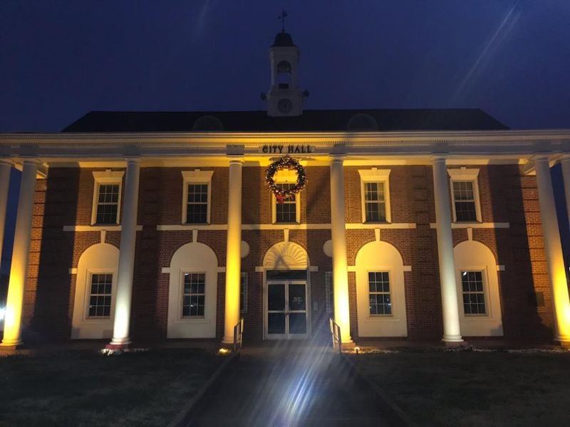 East Point lit up its old (seen here) and new city hall buildings on Tuesday, Jan. 19, 2021 to honor those who lost their lives to COVID-19. (Courtesy of the city of East Point)