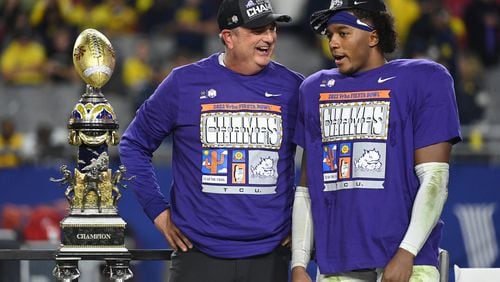 TCU coach Sonny Dykes celebrates with linebacker Dee Winters after the Horned Frogs defeated Michigan 51-45 in the Fiesta Bowl. (Norm Hall/TNS)