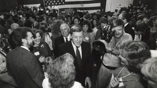 Republican gubernatorial candidate Johnny Isakson works the crowd on the night he won the GOP primary, July 17, 1990, at his party headquarters at the Waverly Hotel. (John Spink / AJC Archive at GSU Library AJCP431-016g)