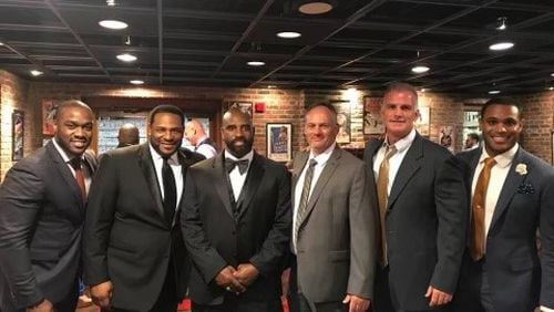 The late Tim Lester, third from the left, was an Eastern Kentucky University alumni. He was inducted into the Kentucky Pro Football Hall of Fame in 2018 and was introduced by Jerome Bettis, second from left, during the ceremony.  Courtesy Alan Brock