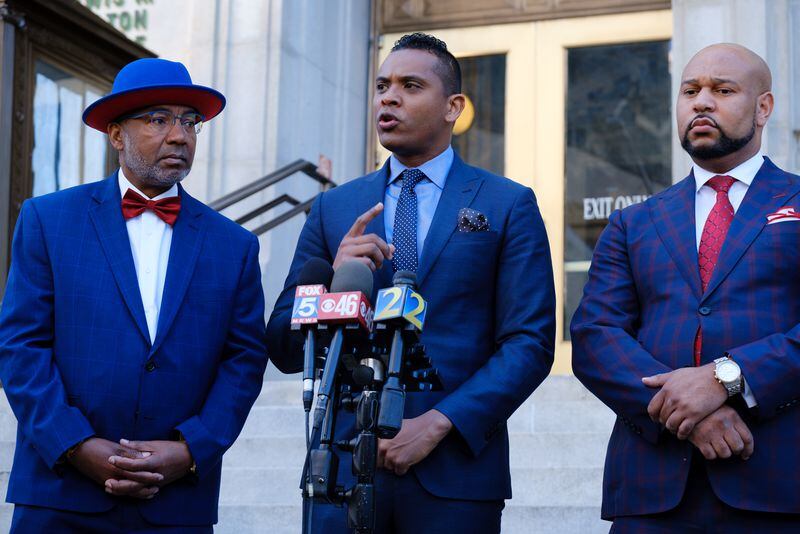 Jackie Patterson, James Bryant, and Carlos Moore (left to right), attorneys for Devin Nolley, are seen at a press conference in Atlanta on Friday, April 15, 2022. Nolley was shot and paralyzed by East Point police officers in 2018.  (Arvin Temkar / arvin.temkar@ajc.com)