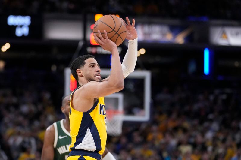 Indiana Pacers' Tyrese Haliburton shoots during the second half of Game 4 of the first round NBA playoff basketball series against the Milwaukee Bucks, Sunday, April 28, 2024, in Indianapolis. (AP Photo/Michael Conroy)