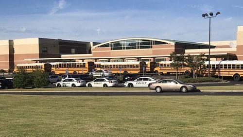 Several police cruisers outside Trickum Middle School on Monday, Oct. 22, 2018.