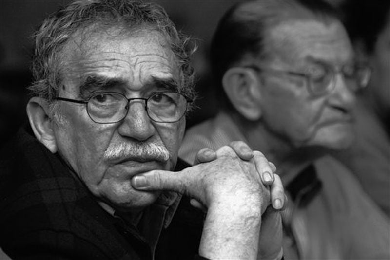 In this 2003 photo released by the Fundación Nuevo Periodismo Iberoamericano (FNPI), Colombian Nobel laureate Gabriel Garcia Marquez, left, is seen in Monterrey, Mexico. Behind is Colombian journalist Jose Salgar. Garcia Marquez died on Thursday, April 17, 2014 at his home in Mexico City. The author's magical realist novels and short stories exposed tens of millions of readers to Latin America's passion, superstition, violence and inequality. The FNPI was founded by Garcia Marquez. (AP Photo/Andres Reyes, FNPI) Learn more about Gabriel Garcia Marquez, left, in this photo tribute. The writer died on Thursday, April 17, 2014 at his home in Mexico City. (AP Photo/Andres Reyes, FNPI)