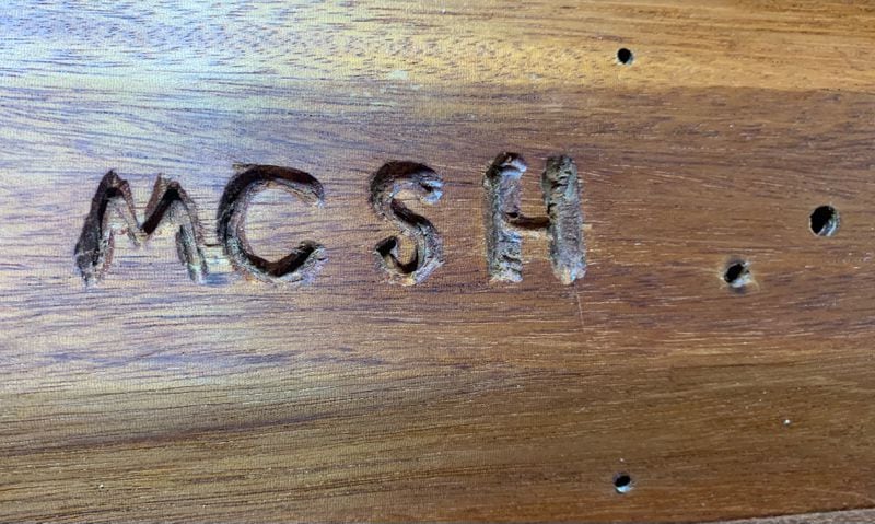 MCSH is carved into the bottom of the box Jim Galloway built from Max Cleland's old bed. It means Max Cleland slept here.